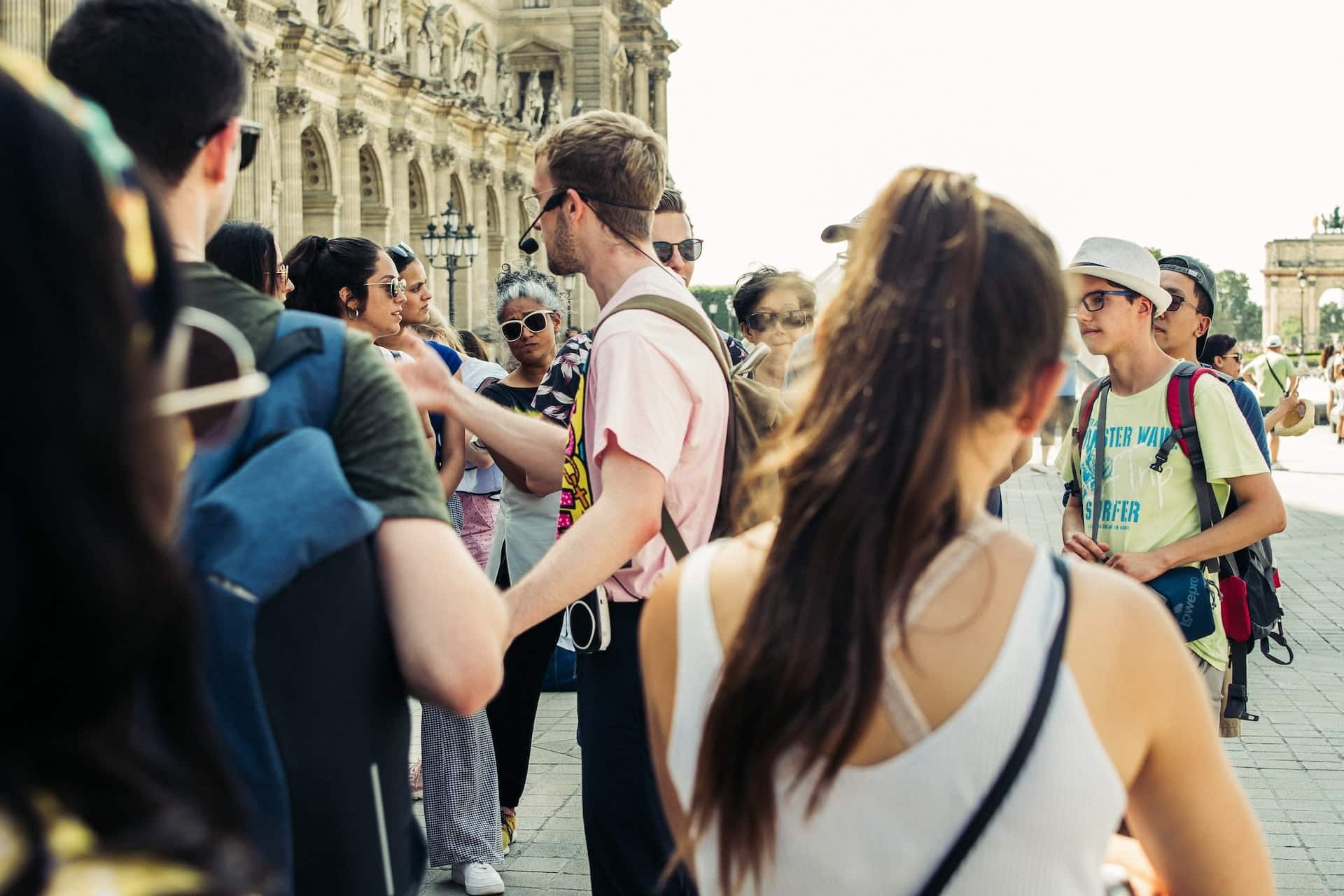 Tour guide leads people