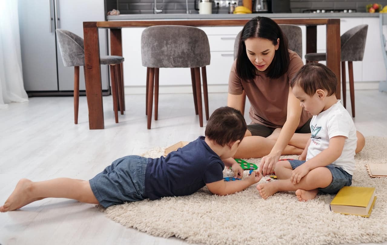 Woman plays with children