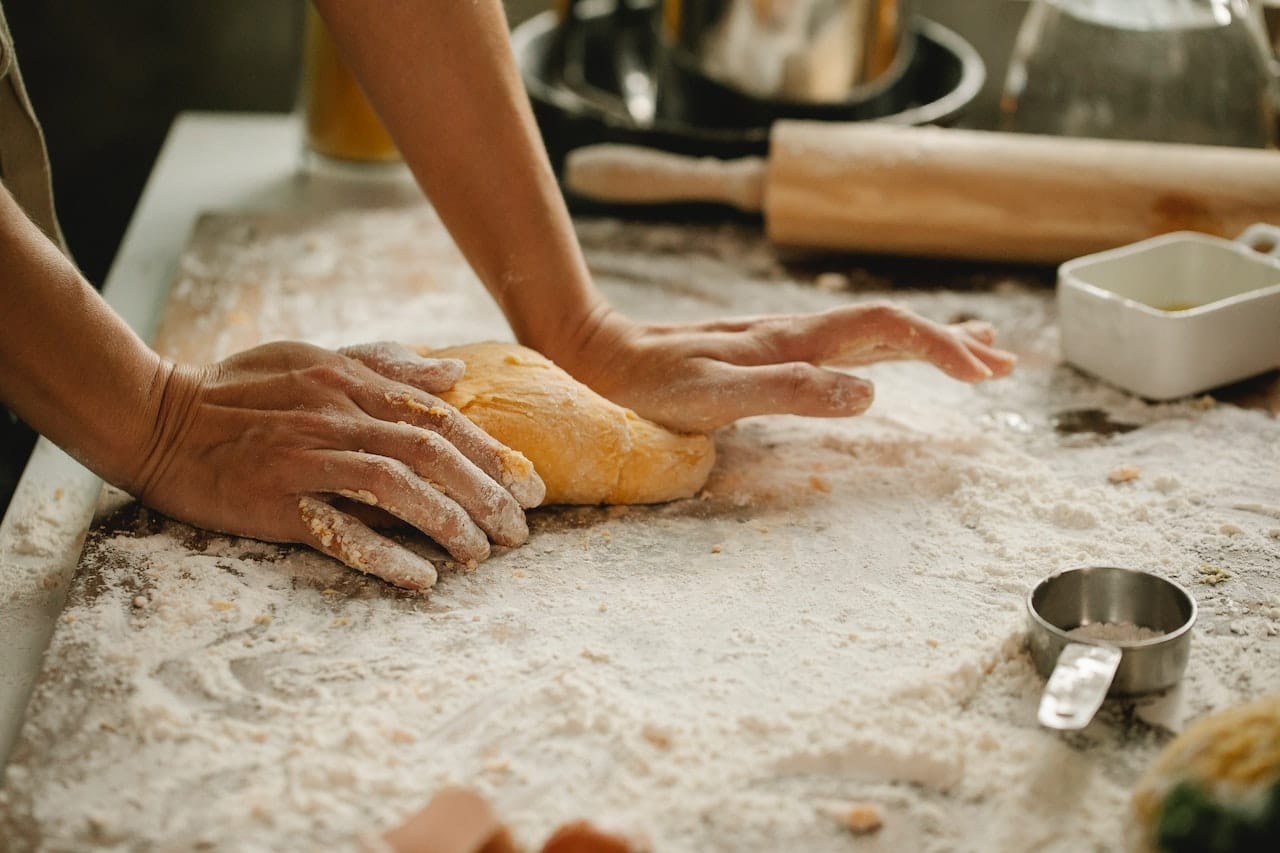 person making dough